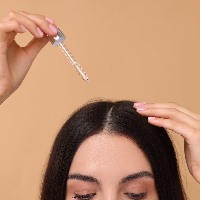 Girl Applying Serum On Hair
